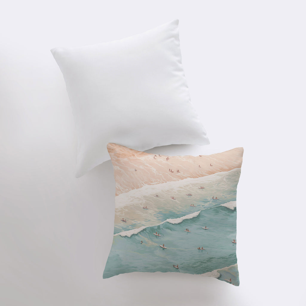 a pillow with a painting of a beach scene on it