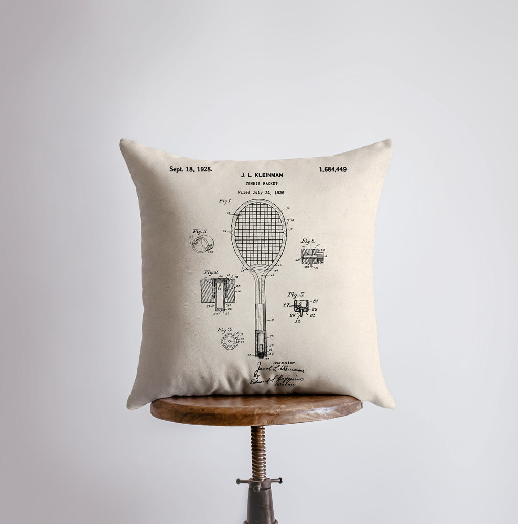 a pillow with a drawing of a tennis racket on it