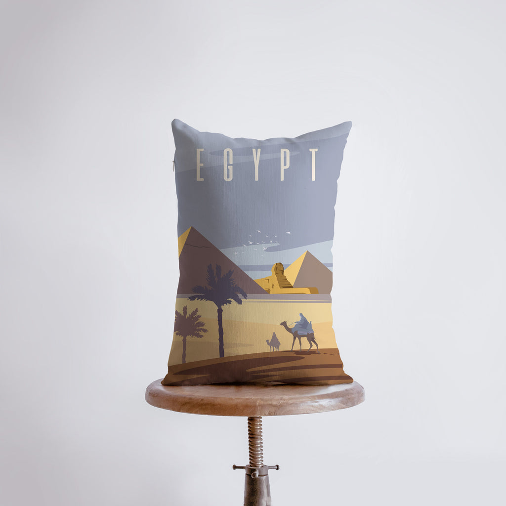 a pillow with a picture of a man riding a camel
