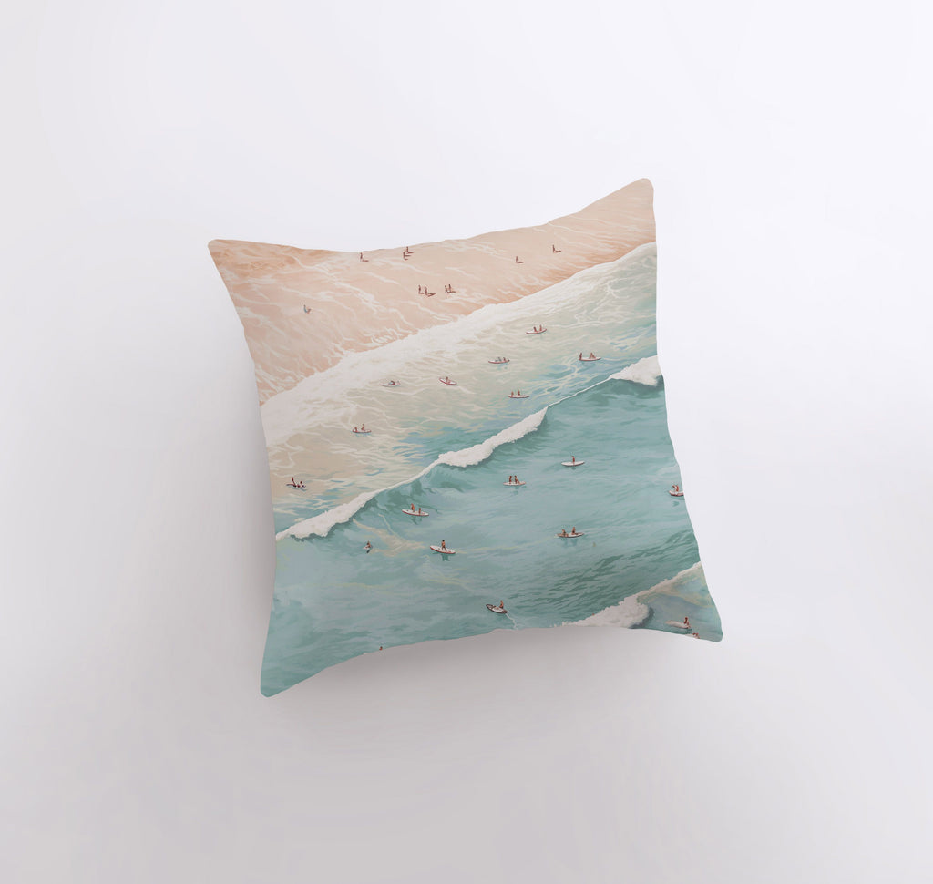 a pillow with a painting of a beach scene