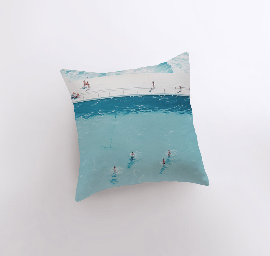 a pillow with a picture of people swimming in the ocean