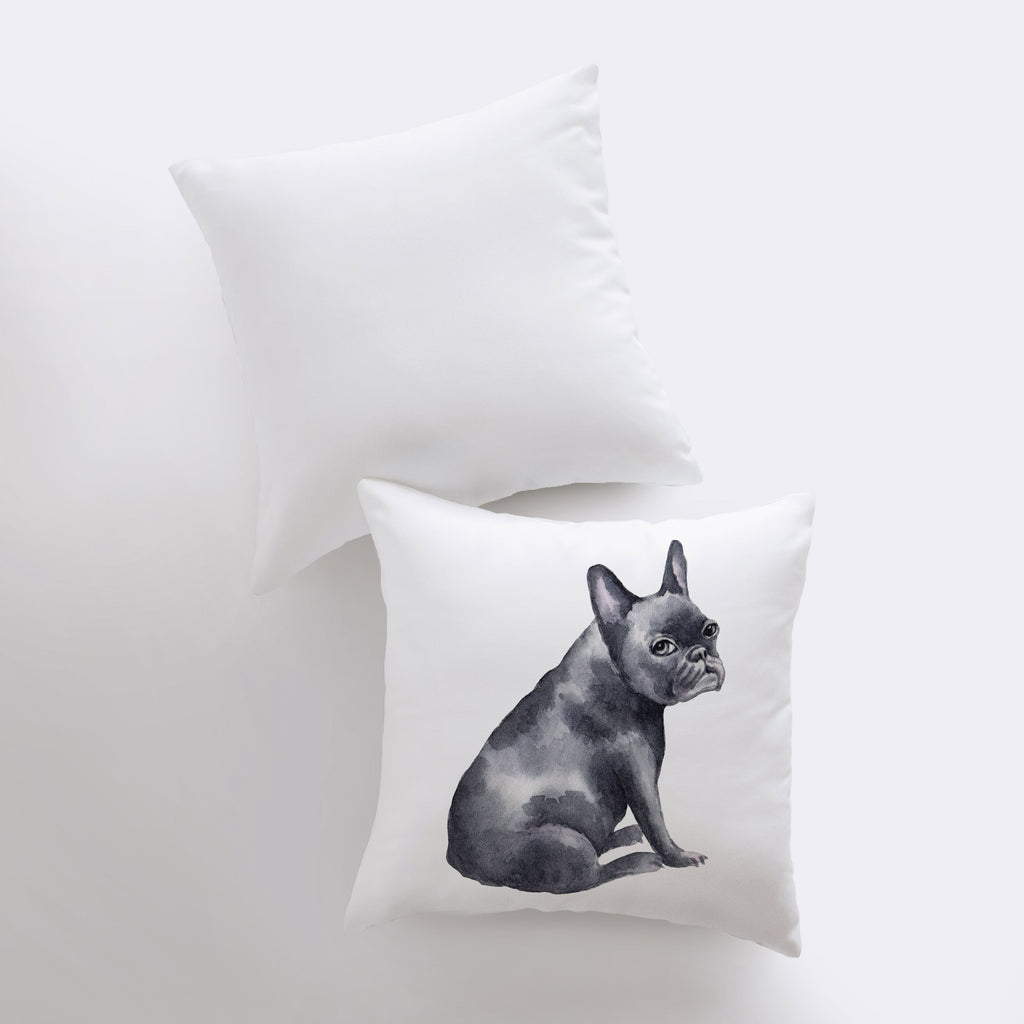 a black and white photo of a dog on a pillow