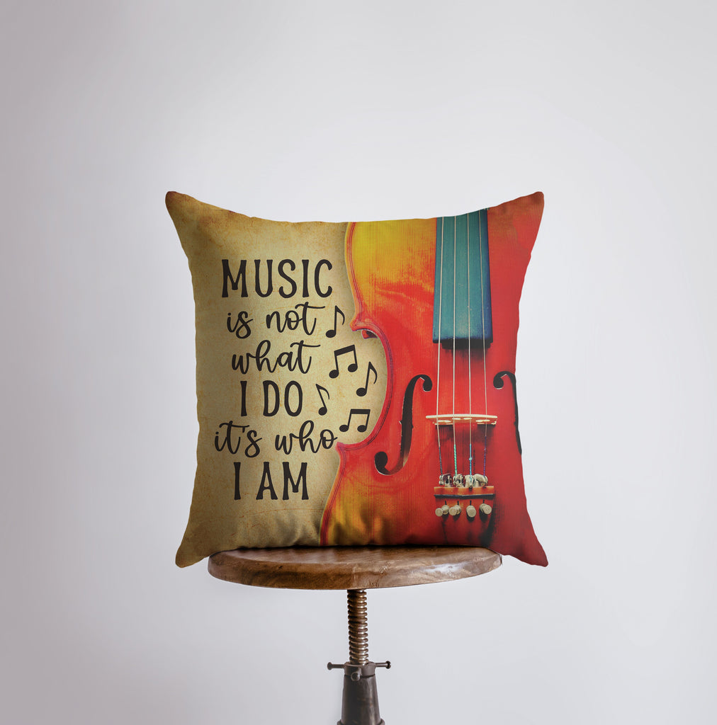 a pillow that has a violin on it