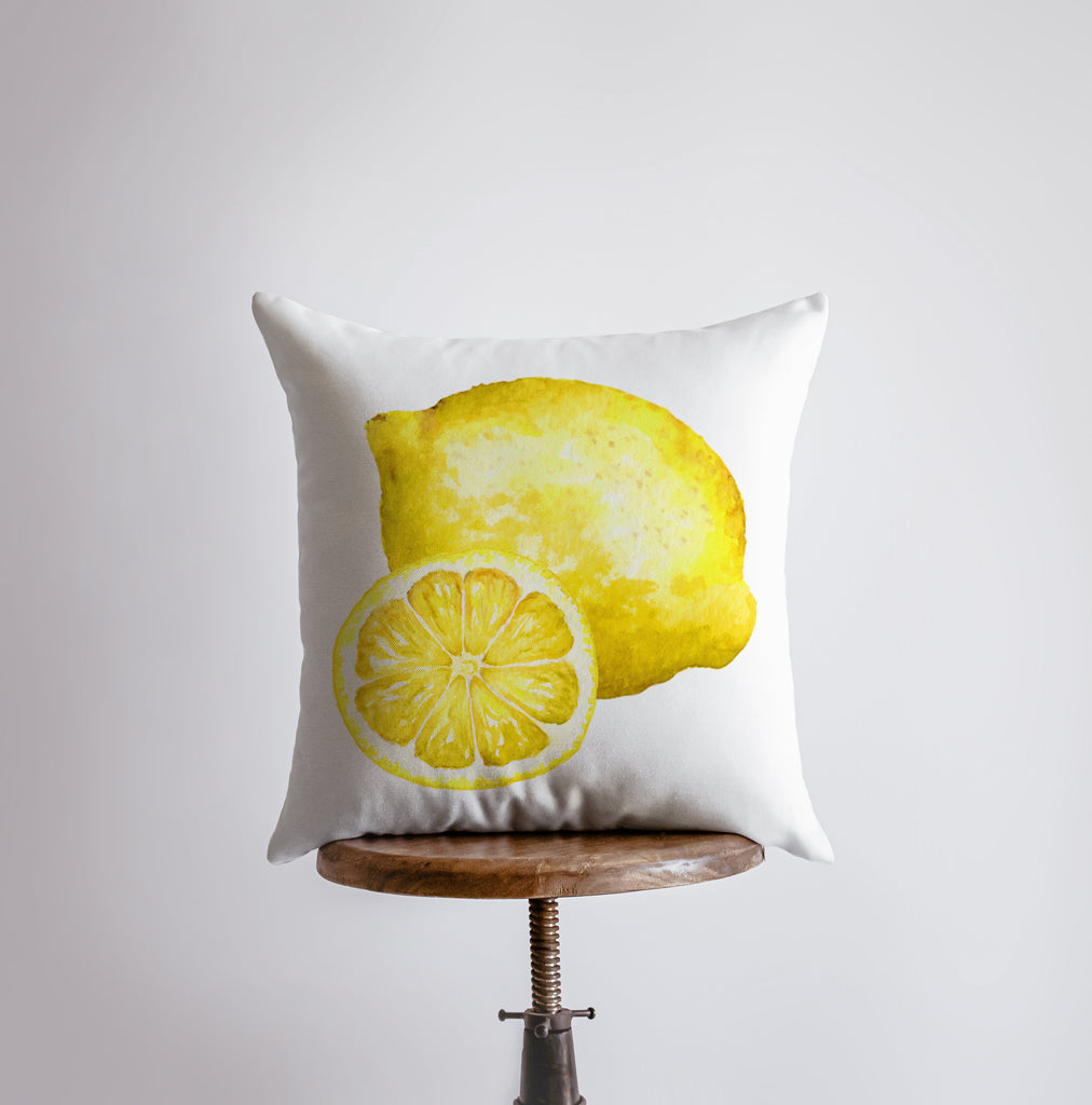 a pillow with a yellow lemon on it