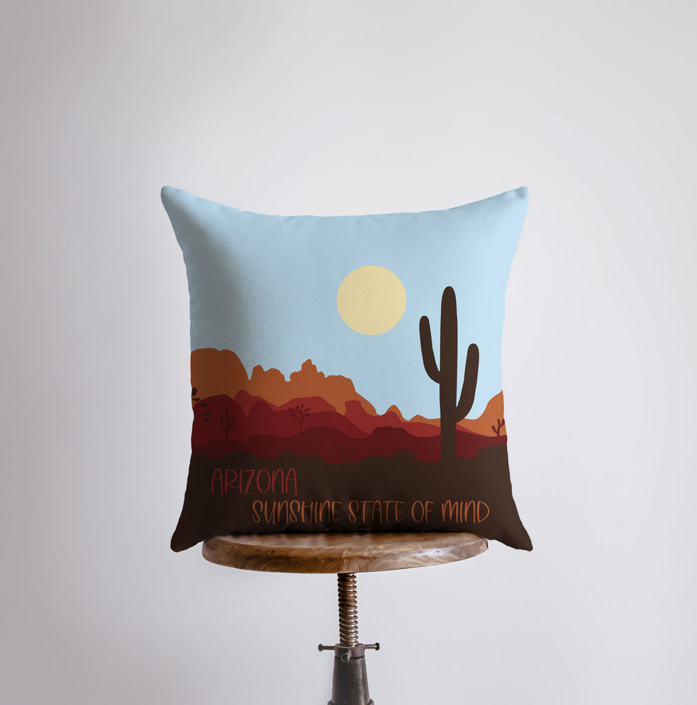 a pillow that has a picture of a cactus on it