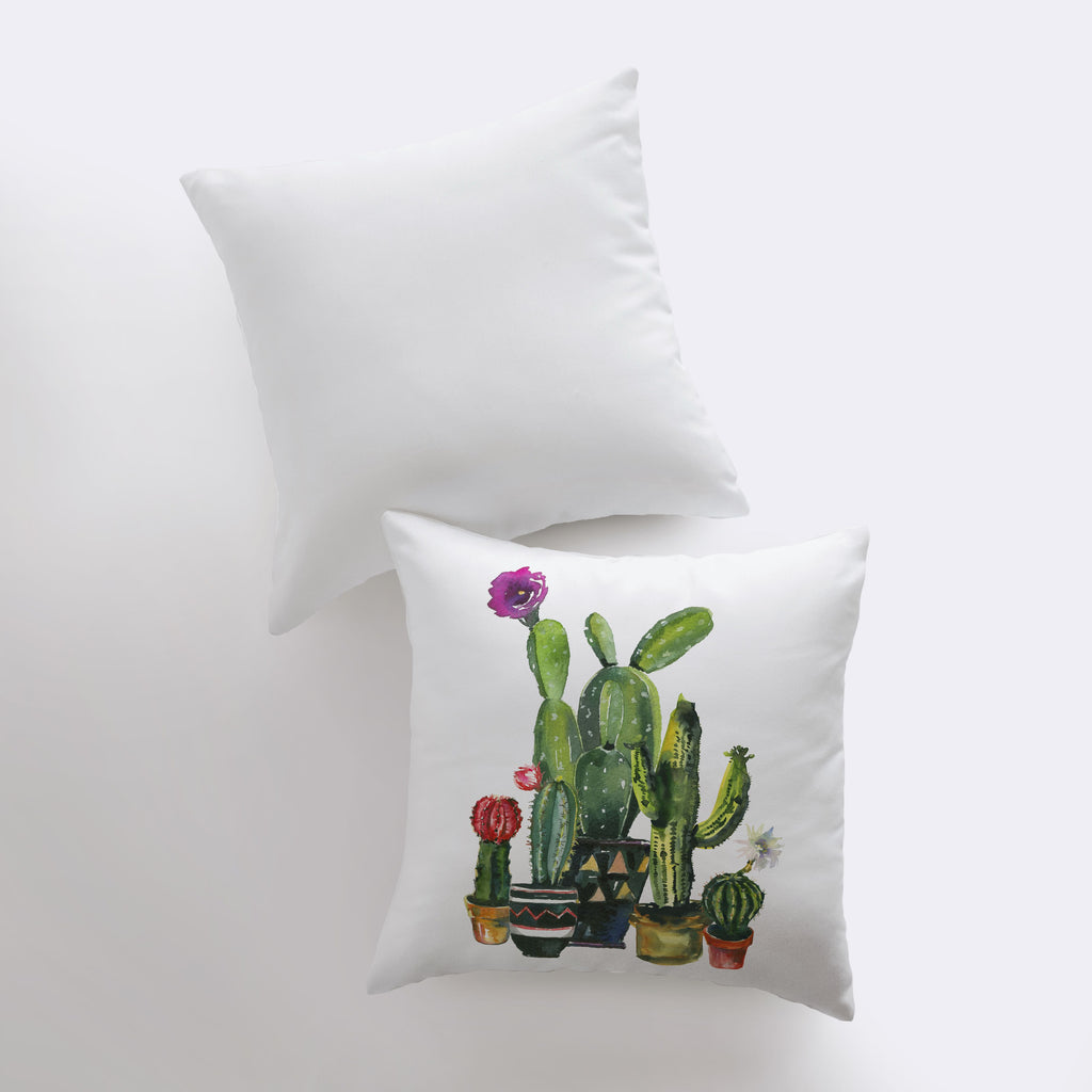 a pair of pillows with a picture of a cactus on them