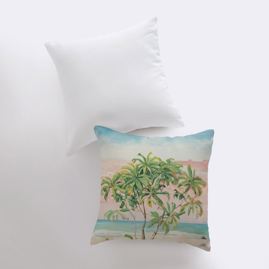 a pillow with a painting of a palm tree on it