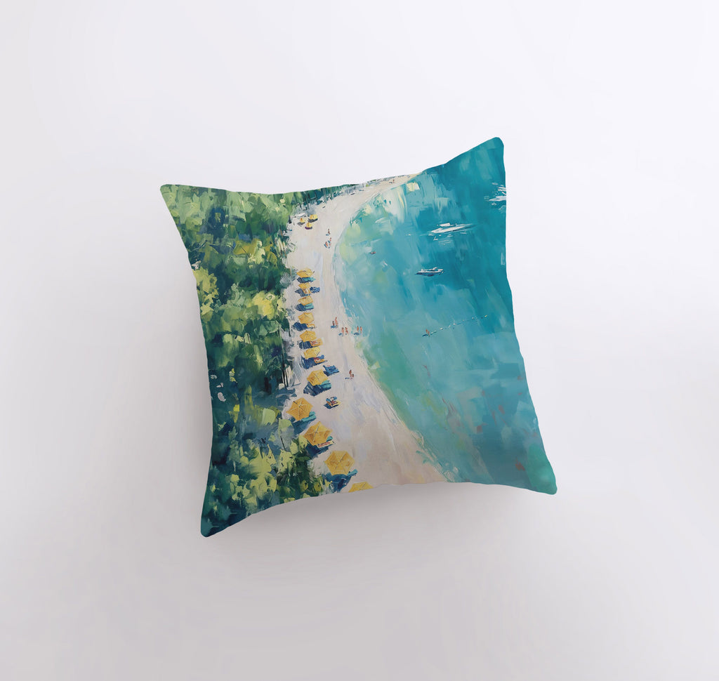 a pillow with a painting of a beach and trees