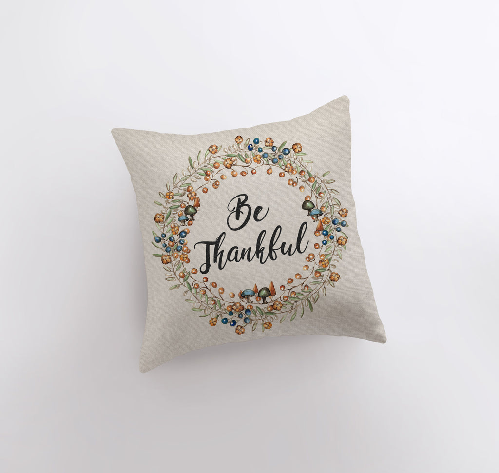 a pillow with the words be grateful on it