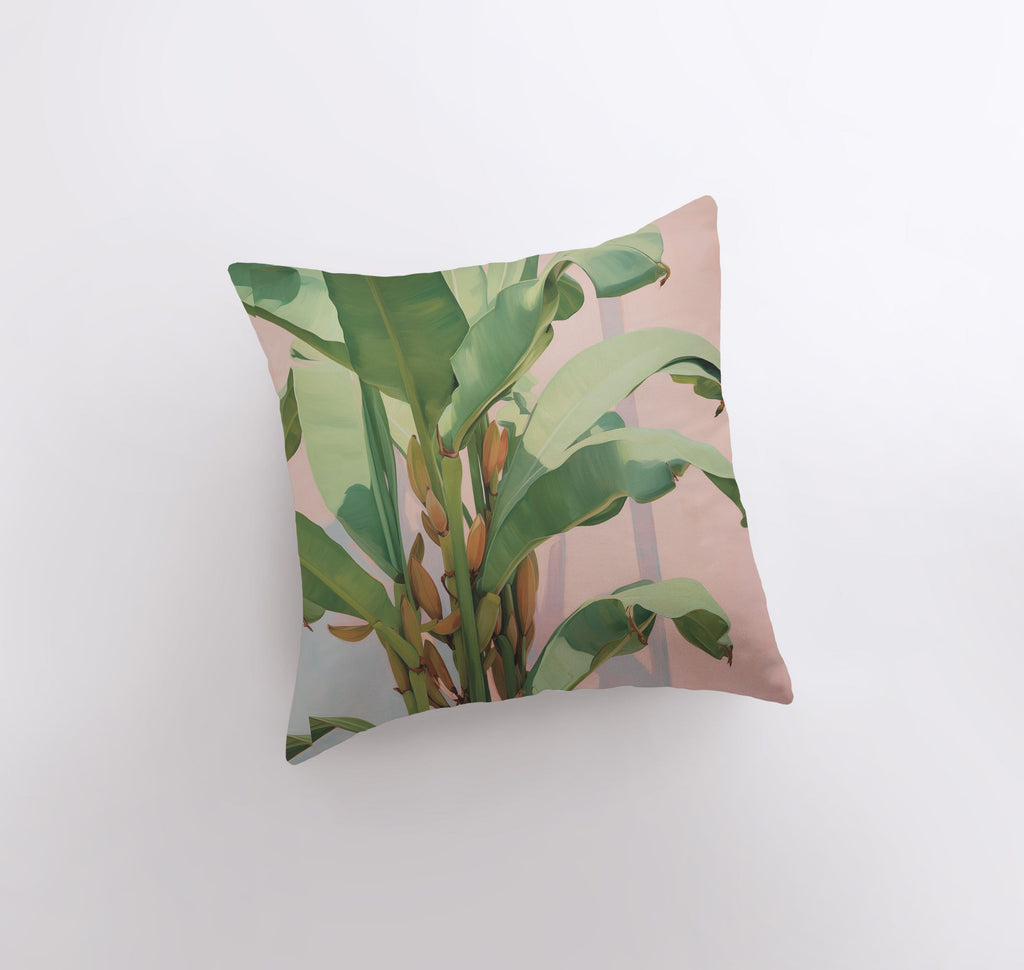 a pillow that has a plant on it