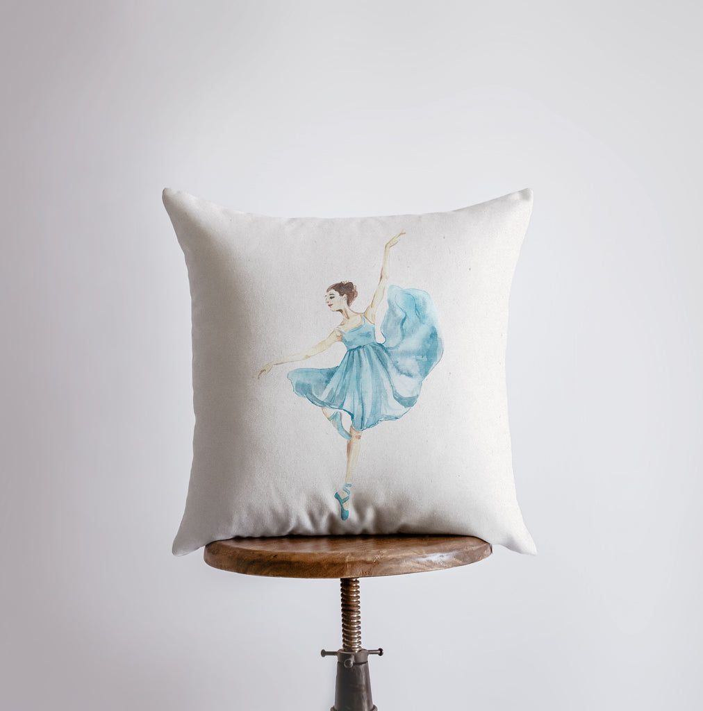 a pillow that has a ballerina on it