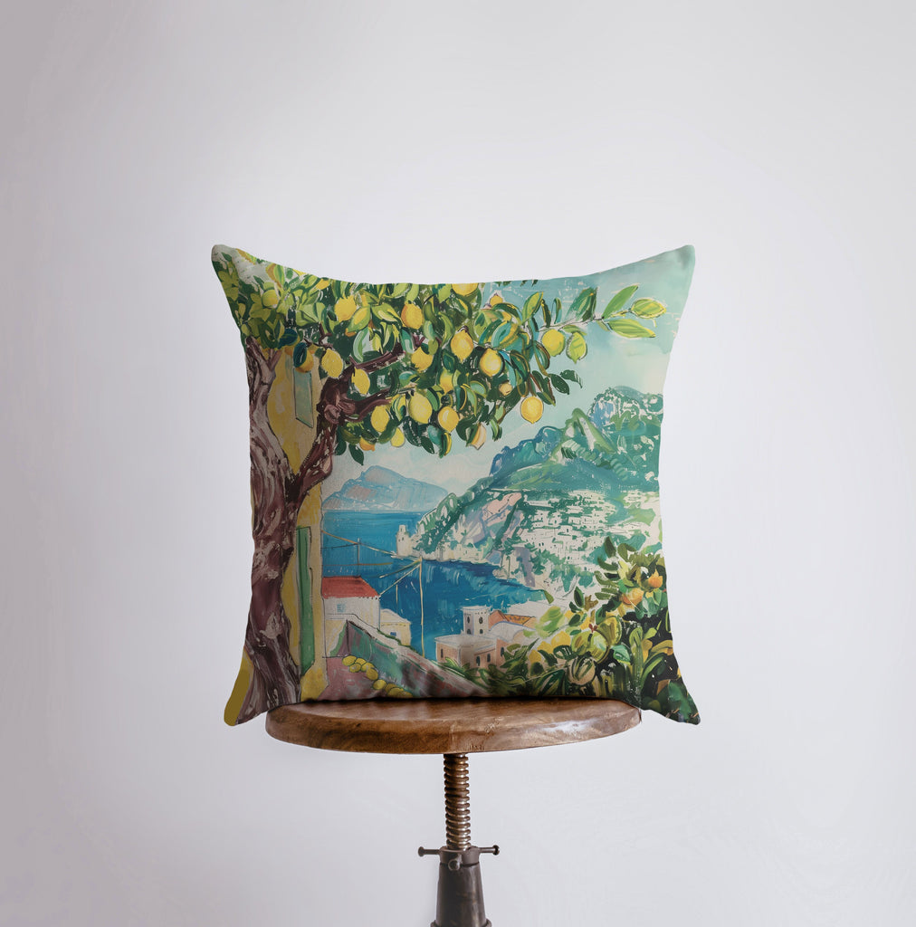 a pillow with a painting of a lemon tree