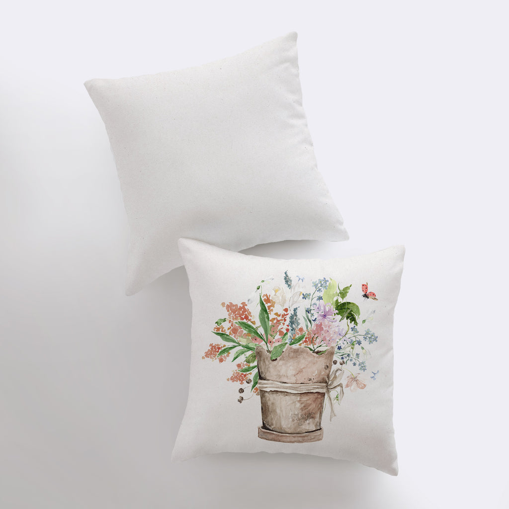 a pillow with a picture of a flower pot on it