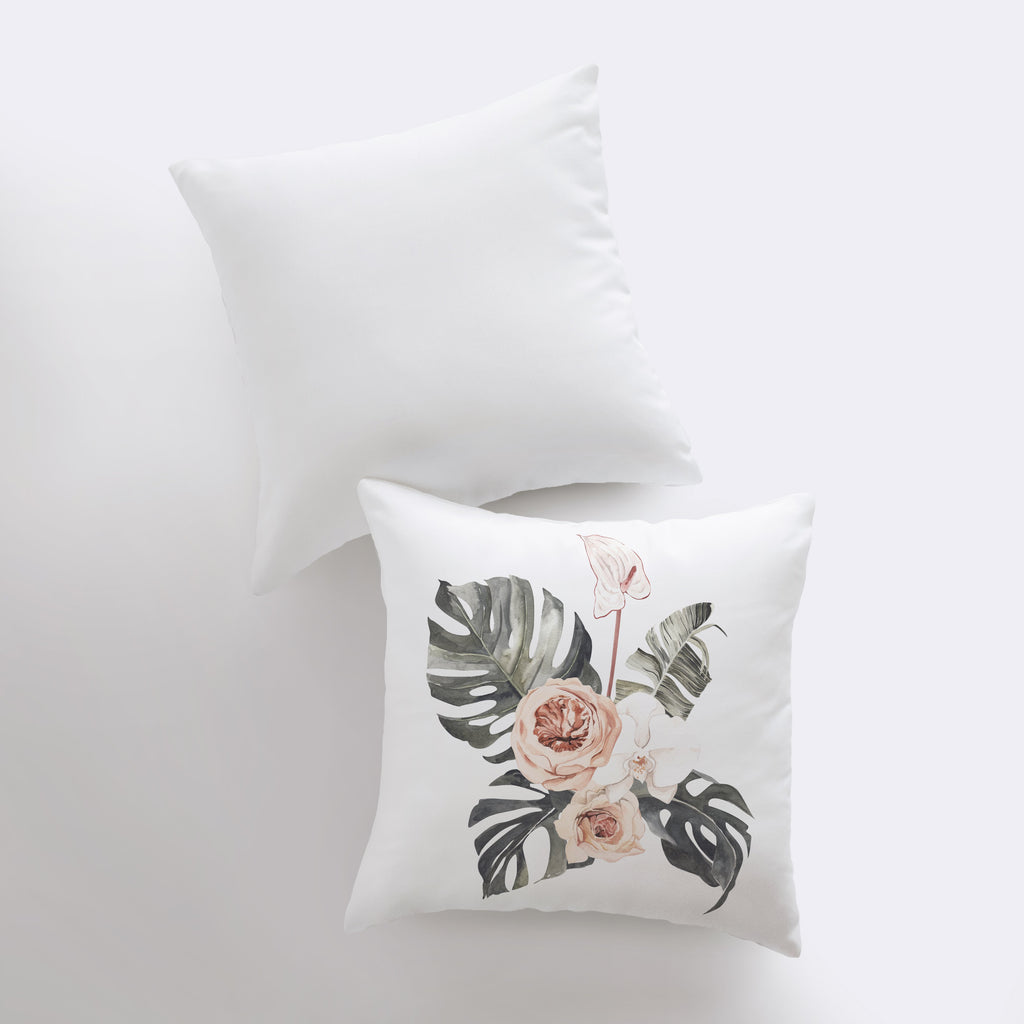 two white pillows with pink flowers on them