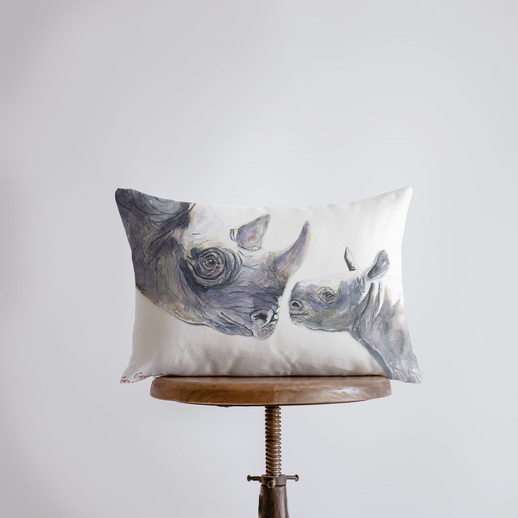 a pillow that has a rhino on it