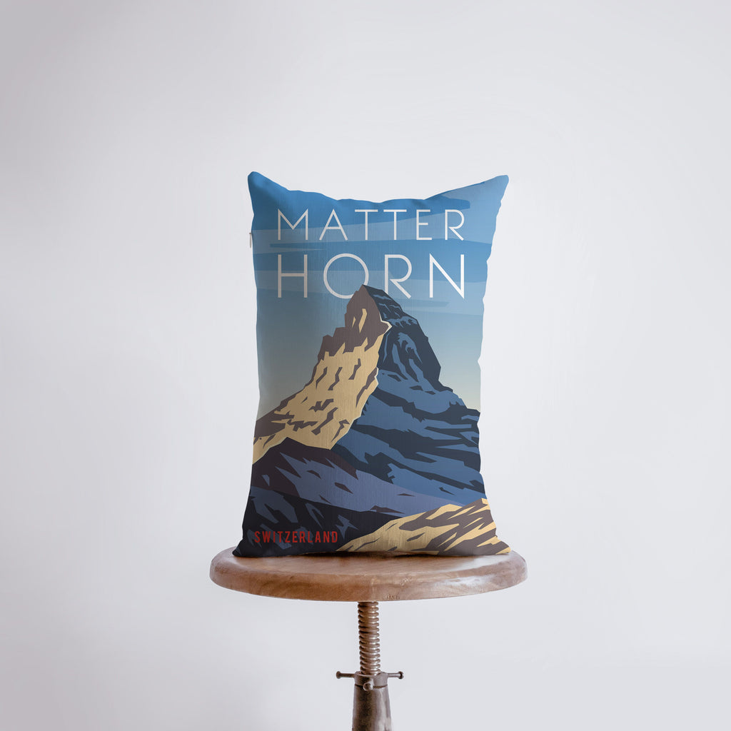 a pillow with a picture of a mountain on it