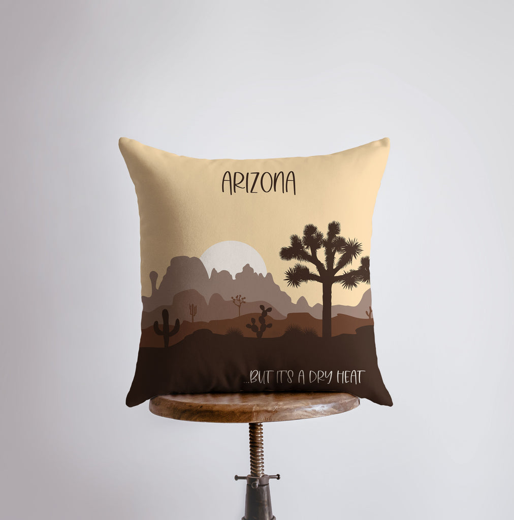 a pillow with a desert scene on it