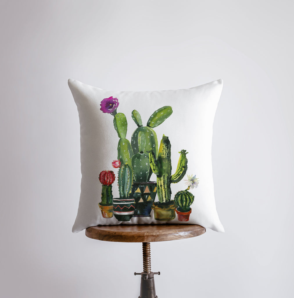 a pillow with a picture of a cactus on it