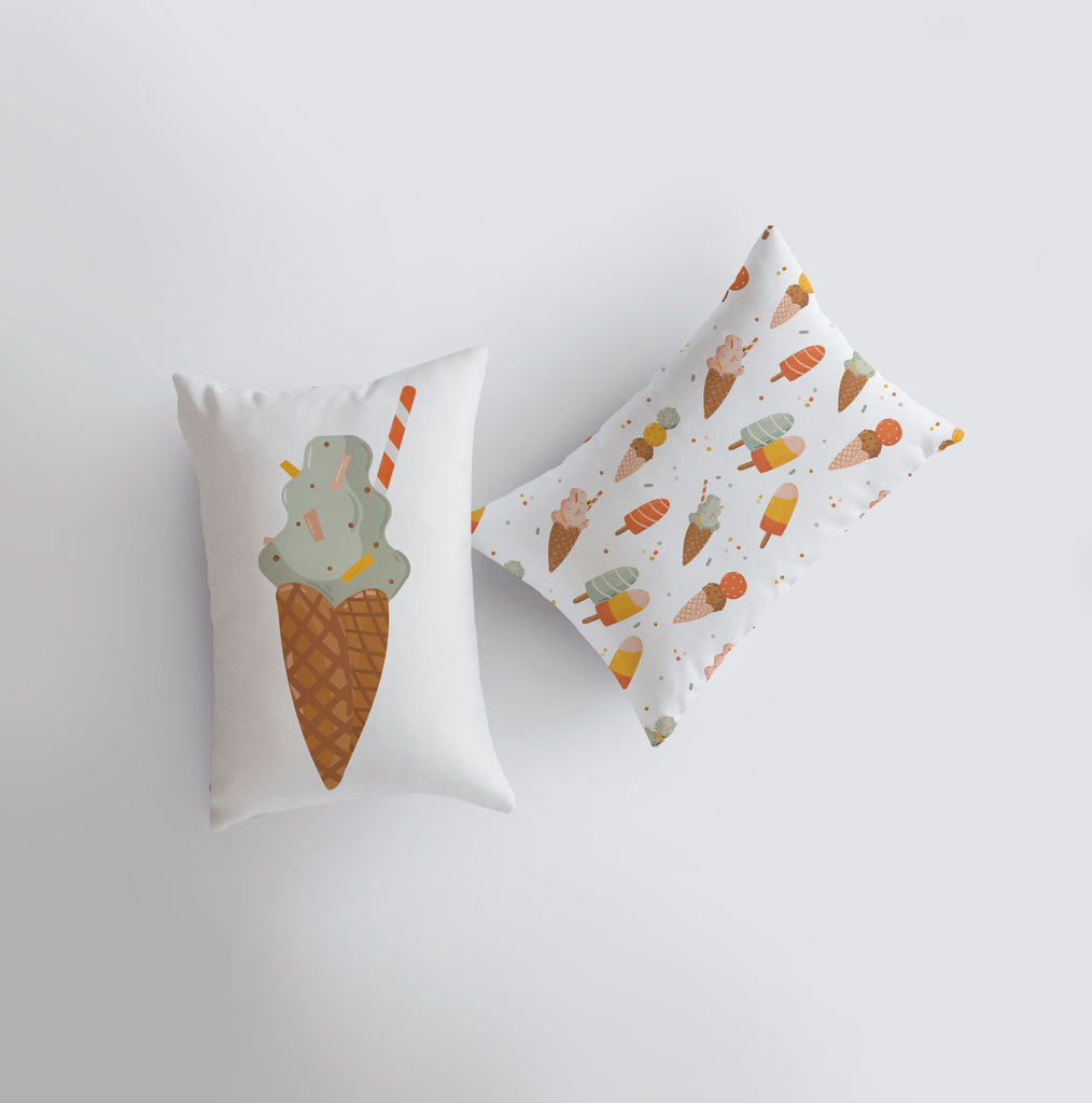 a couple of pillows sitting on top of a white wall