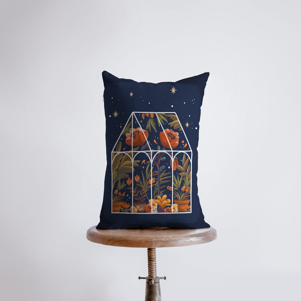 a pillow with a picture of a greenhouse on it