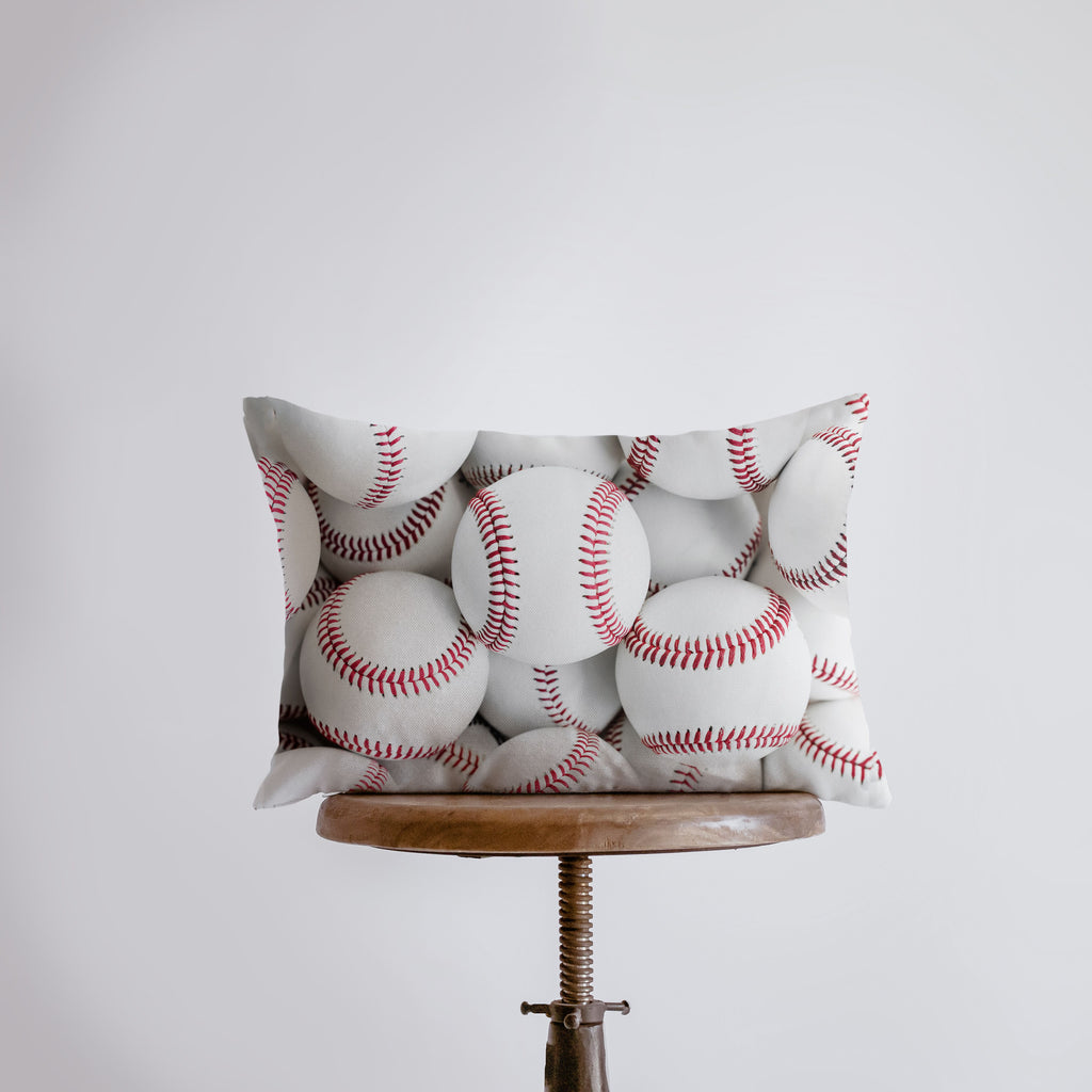 a bunch of baseballs sitting on top of a table