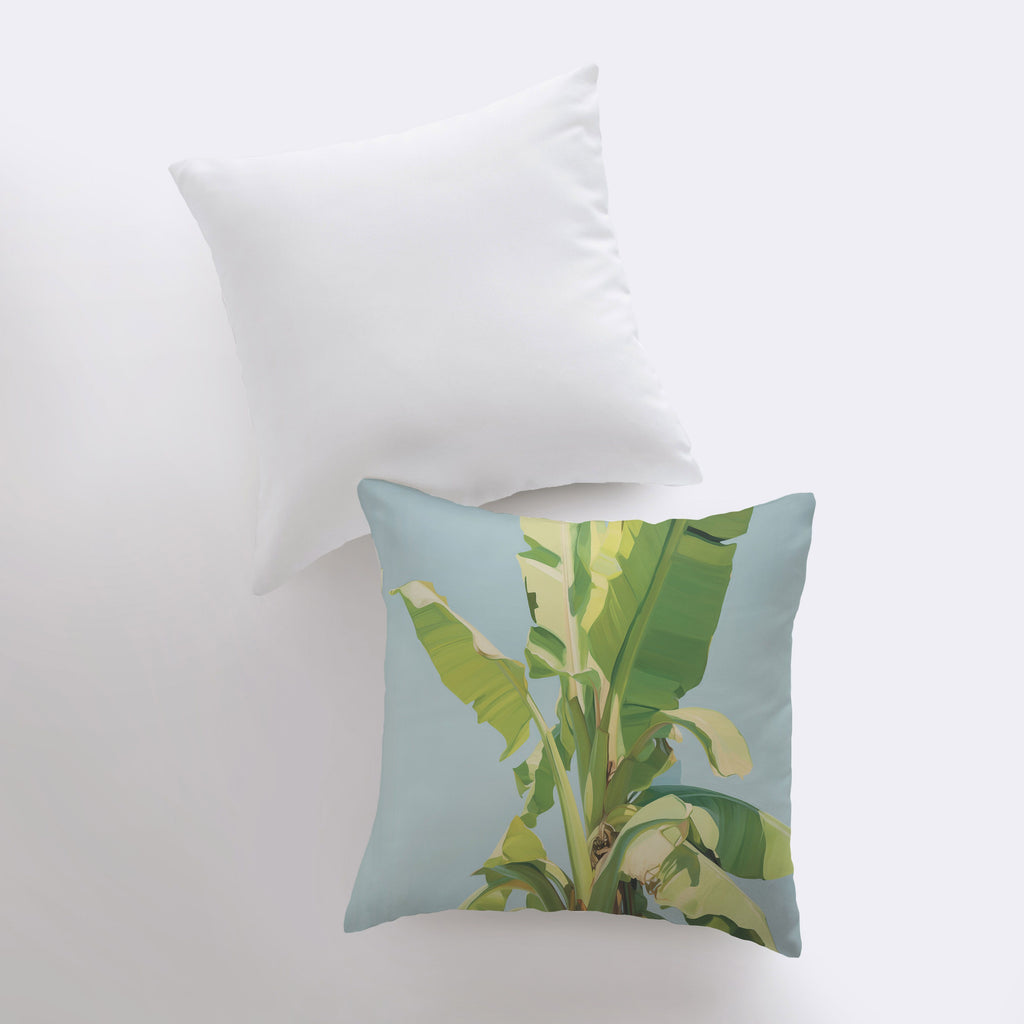 a pillow with a picture of a banana plant on it