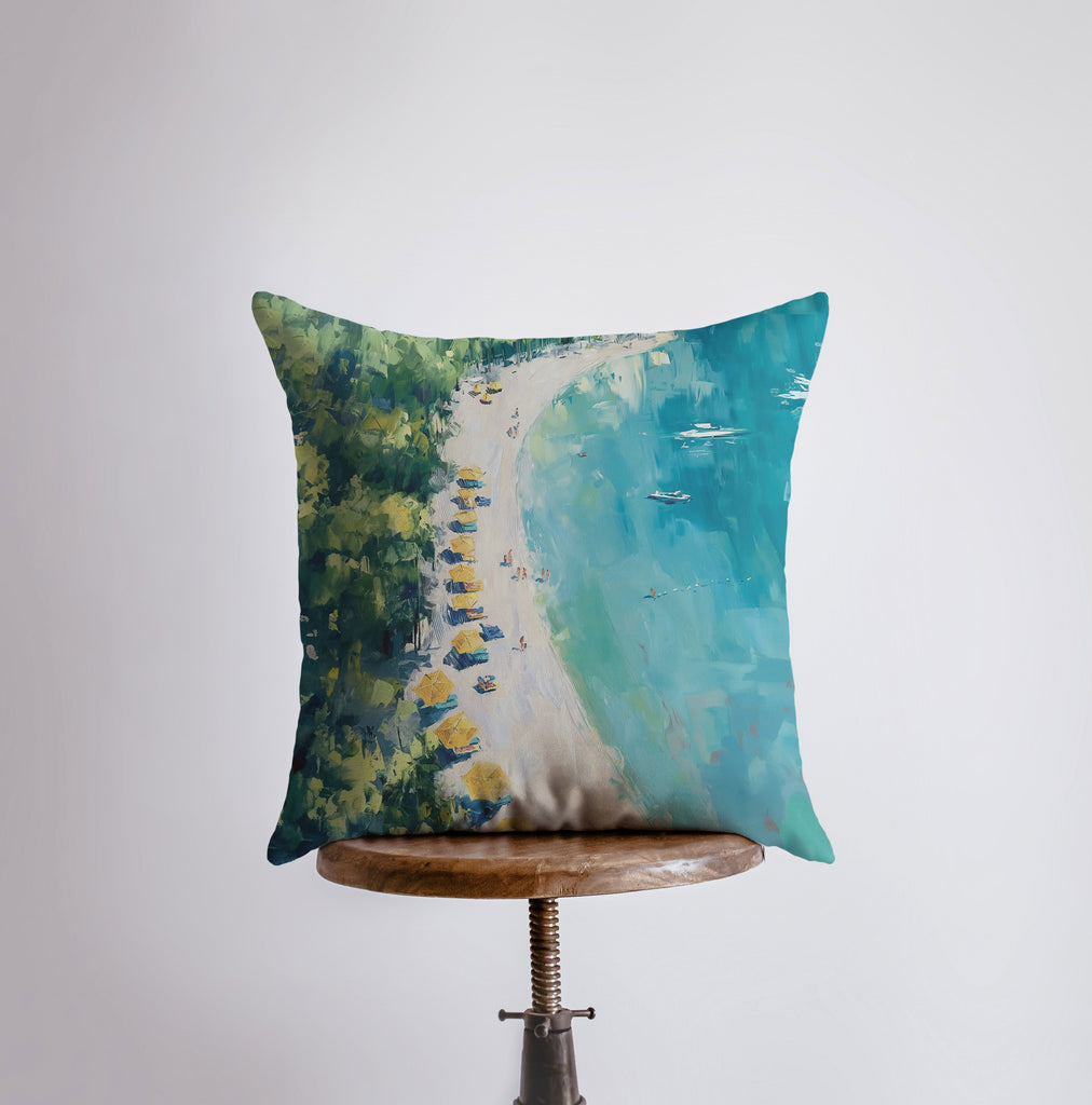 a pillow with a painting of a beach