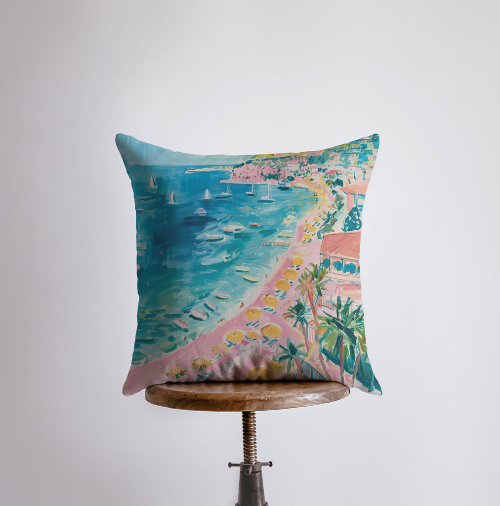 a pillow with a painting of a beach on it