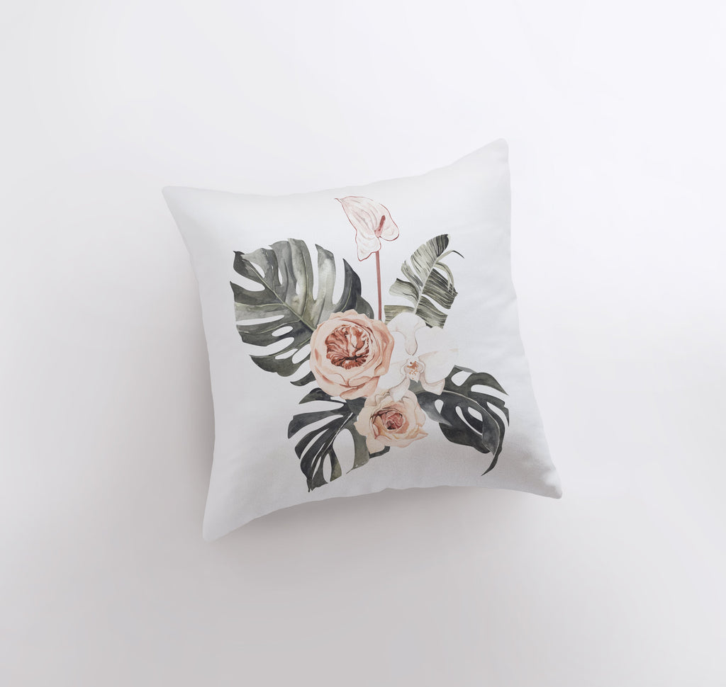 a white pillow with a floral design on it