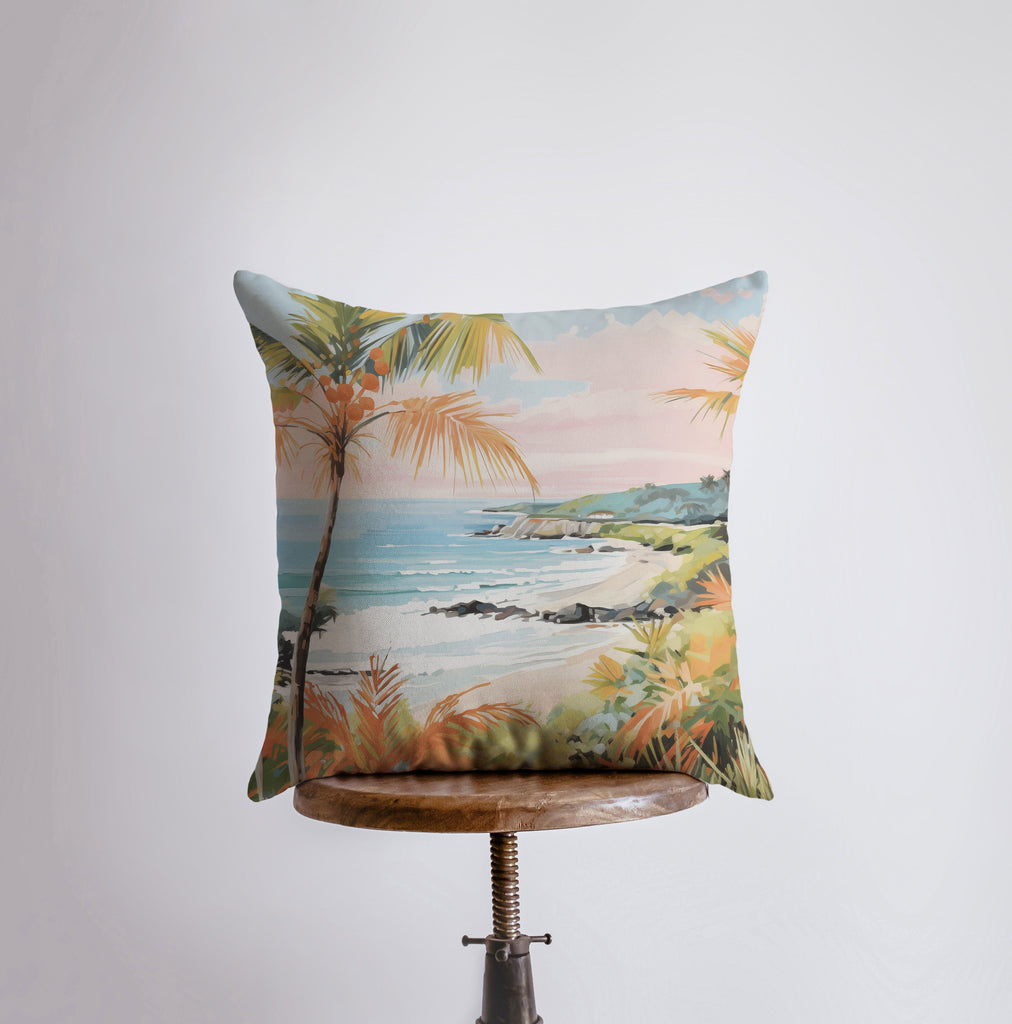 a pillow that has a painting of a beach on it