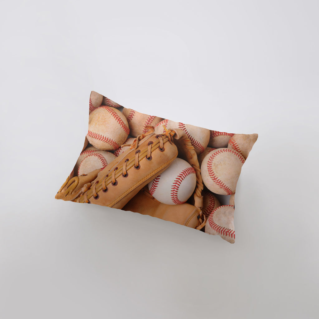 a pillow with a baseball and glove on it