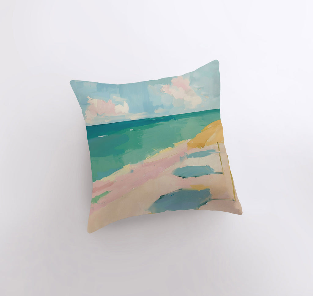 a pillow with a painting of a beach