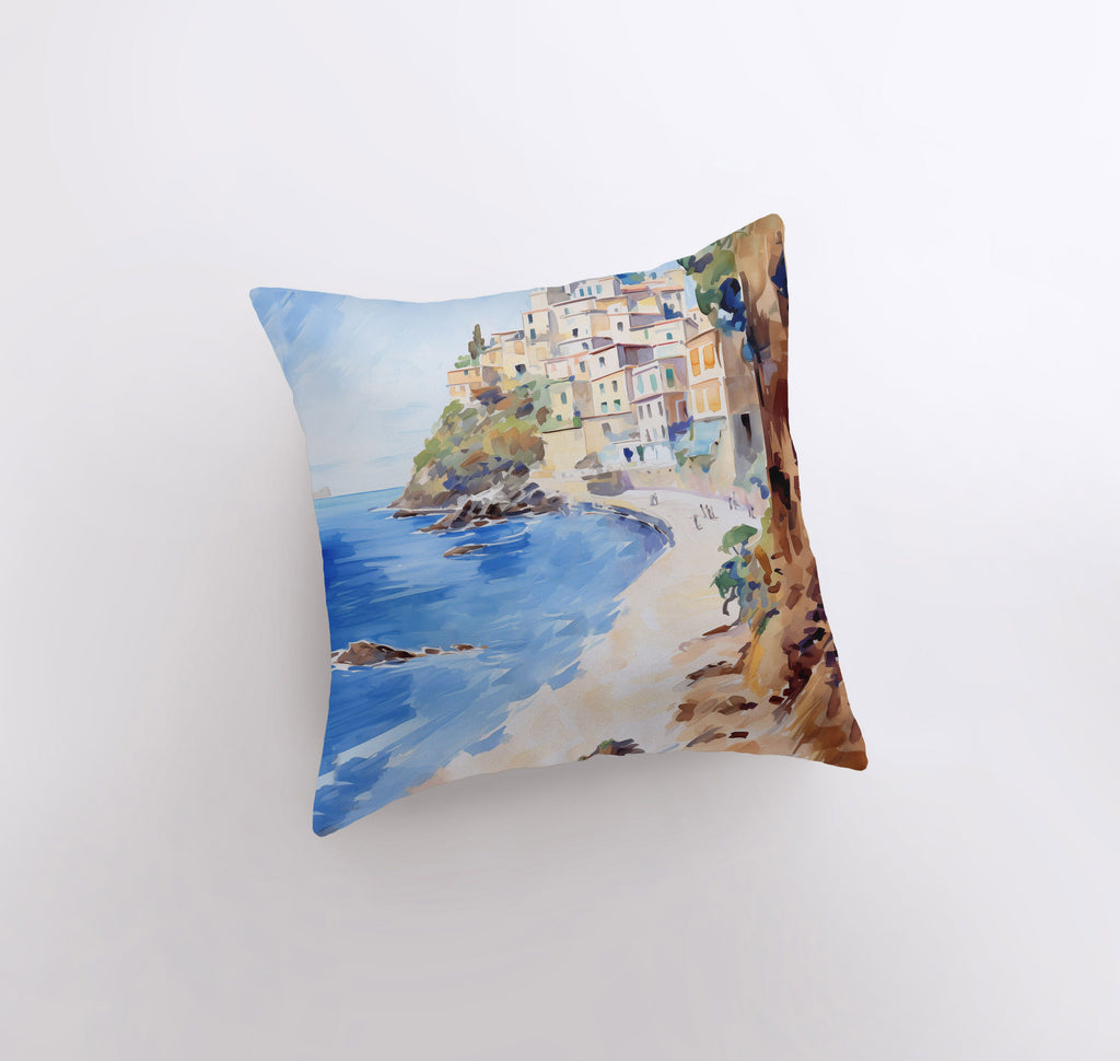 a pillow with a painting of a beach scene