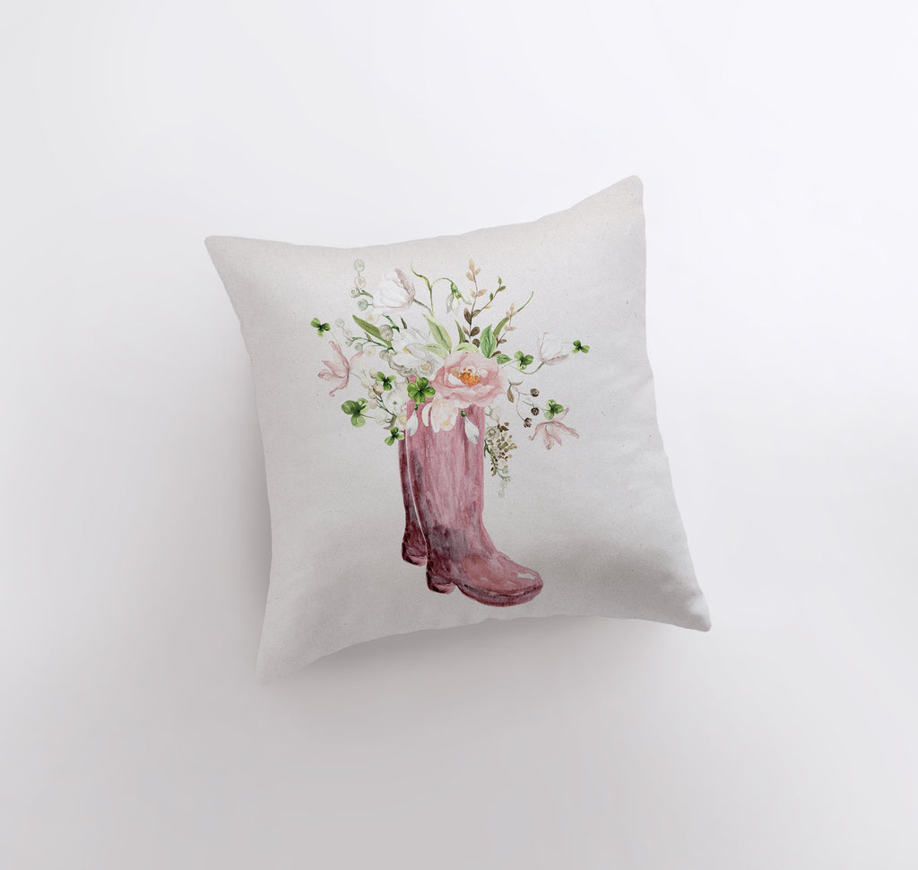 a pillow with a pink boot and flowers on it