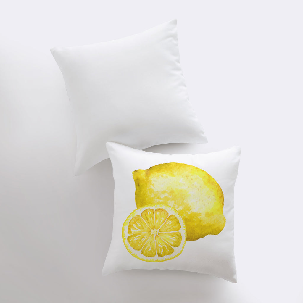 a pair of pillows with a lemon on them