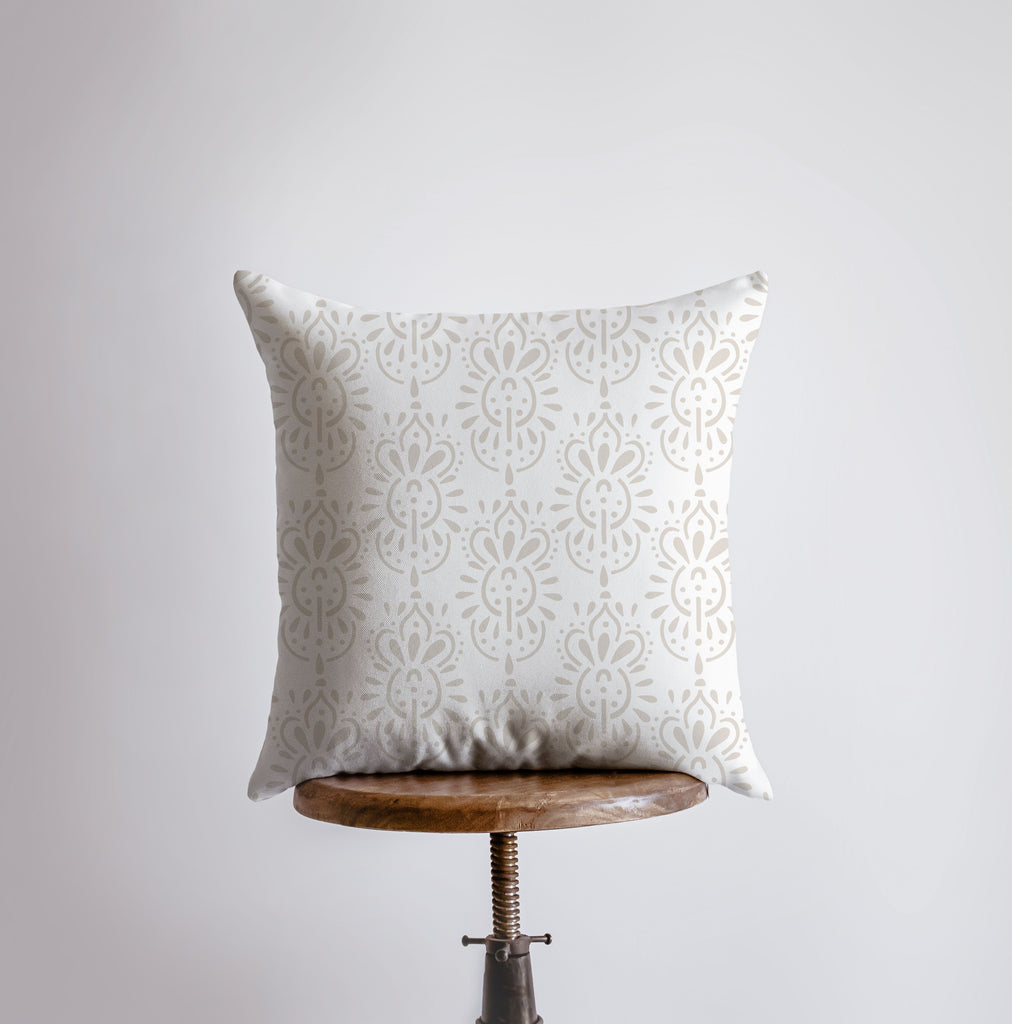 a white pillow sitting on top of a wooden table