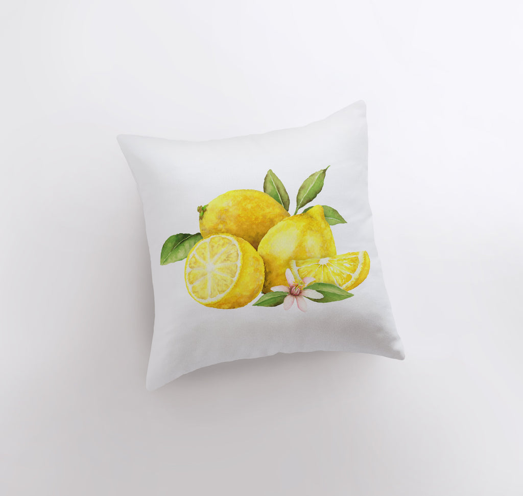 a pillow with a painting of lemons on it