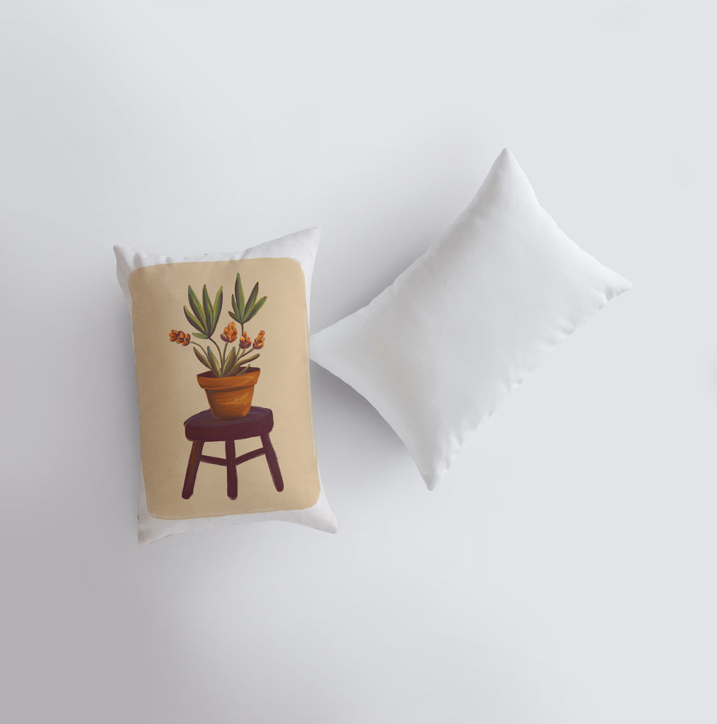 a pillow with a potted plant on it