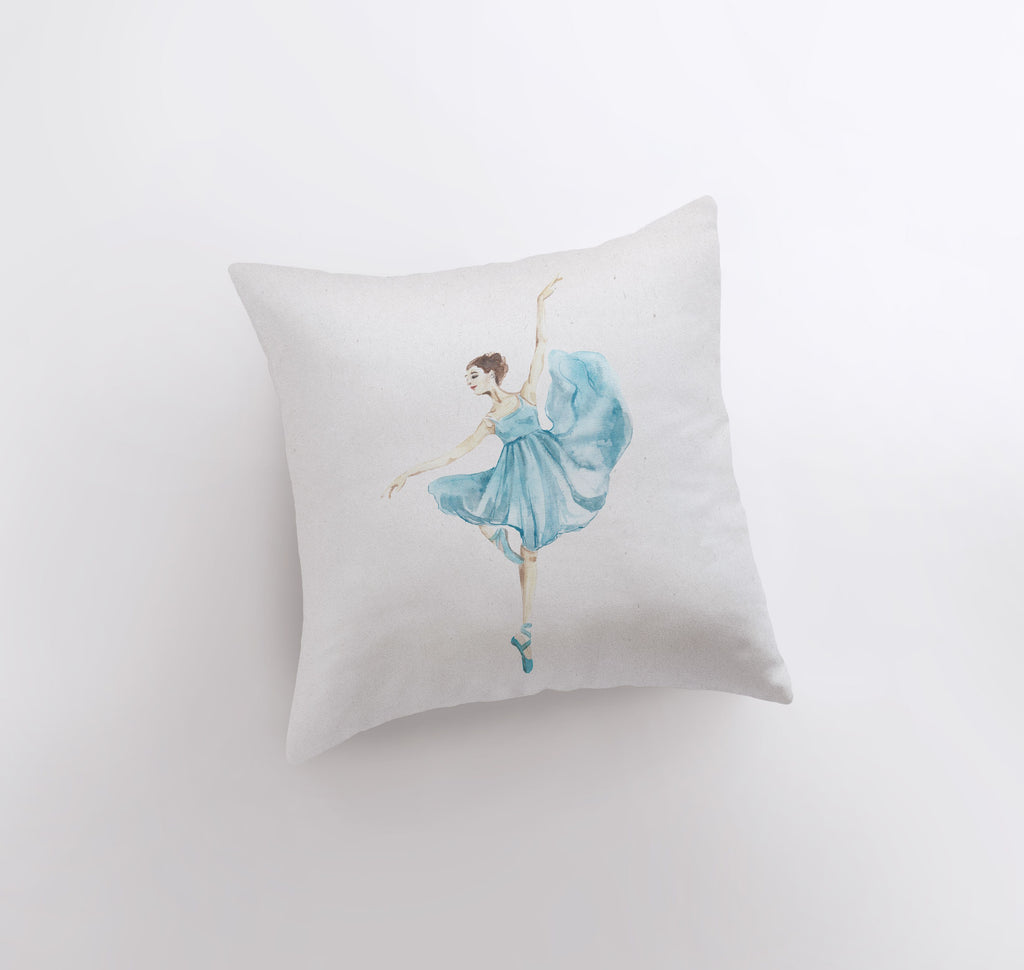 a white pillow with a watercolor painting of a ballerina