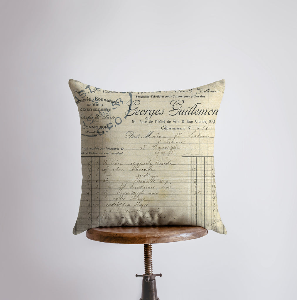 a pillow on a table with a piece of writing on it