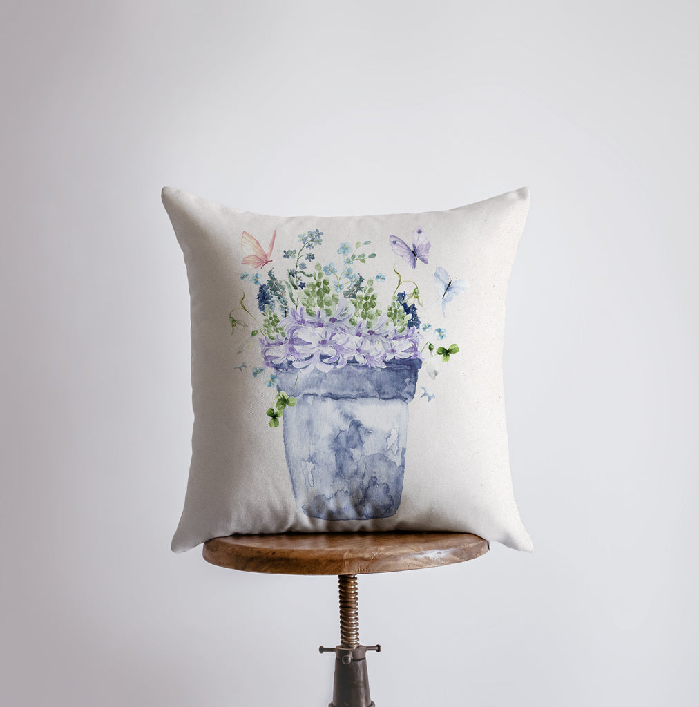 a pillow with a picture of a flower pot on it