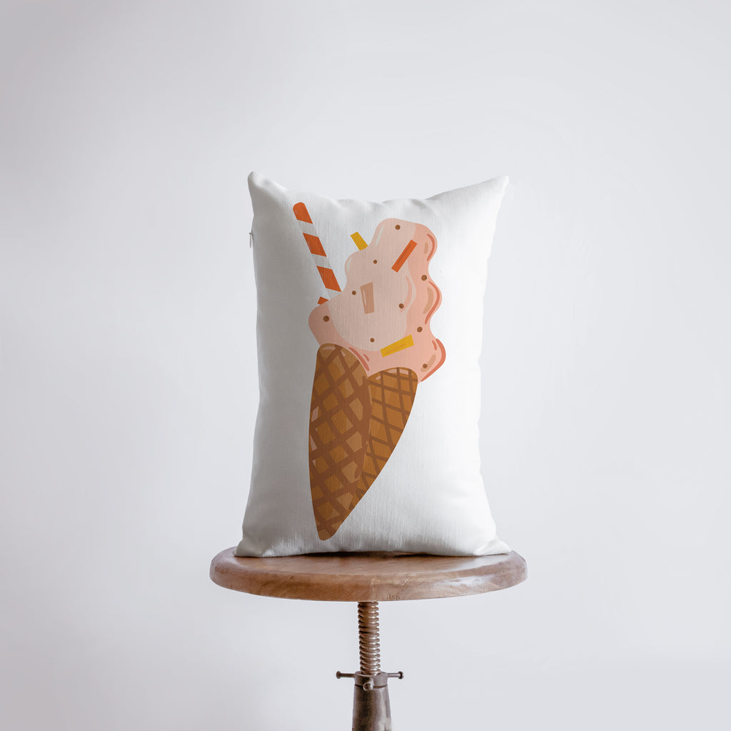 a pillow with an ice cream cone on it