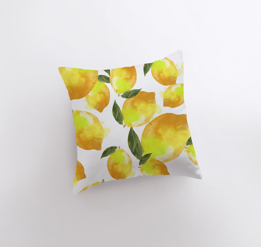 a white pillow with yellow lemons on it