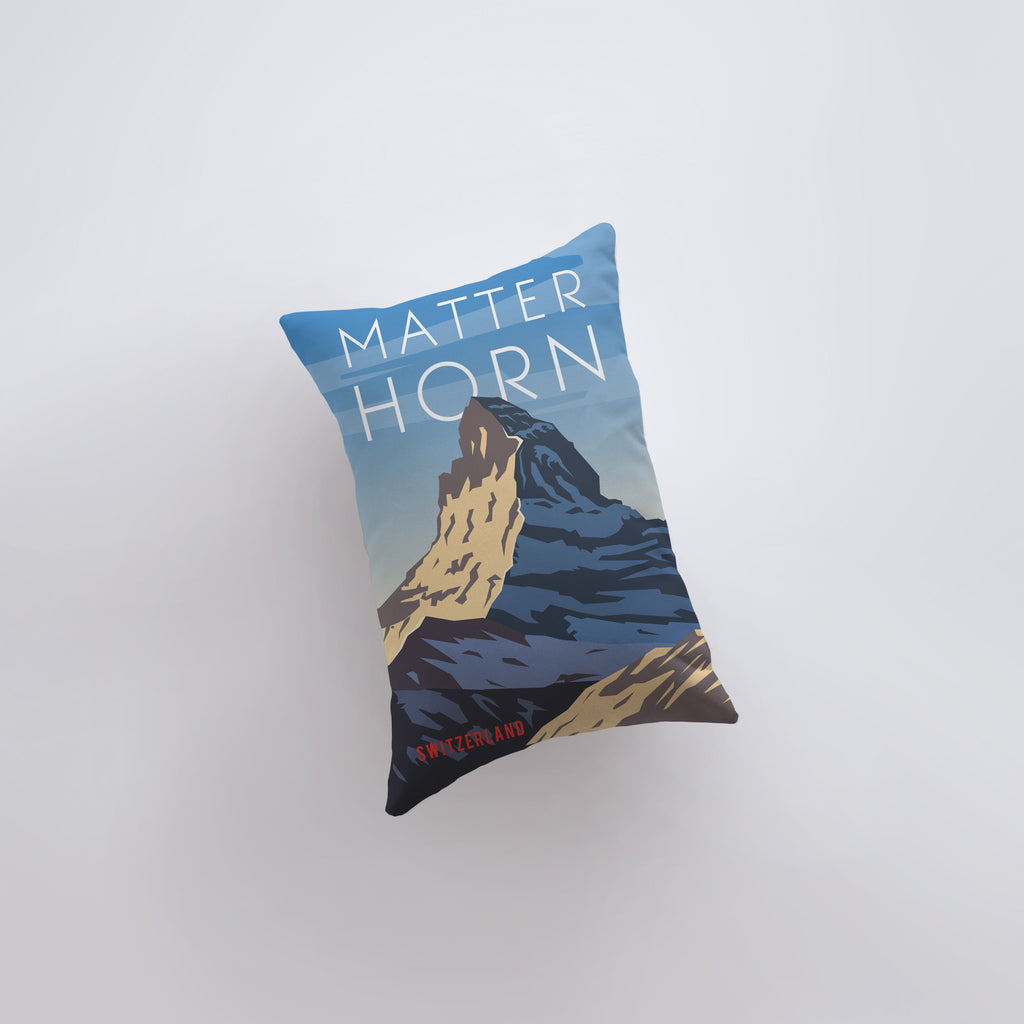 a pillow that has a picture of a mountain on it