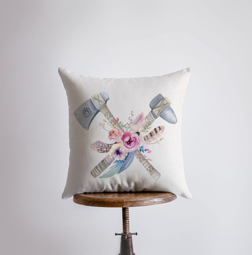 a white pillow with a floral design on it