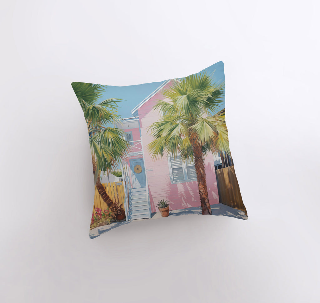 a pink house with palm trees on a white background