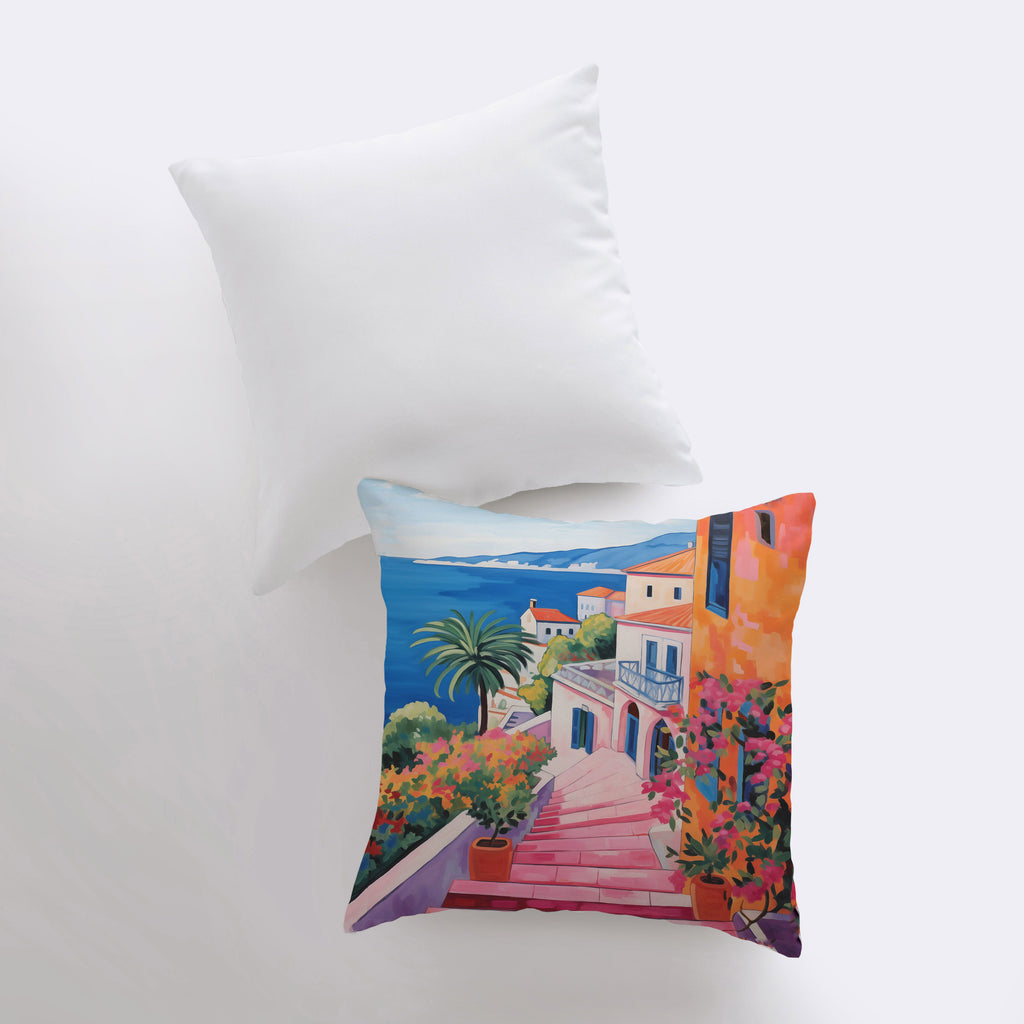 a pillow with a painting of a house on it