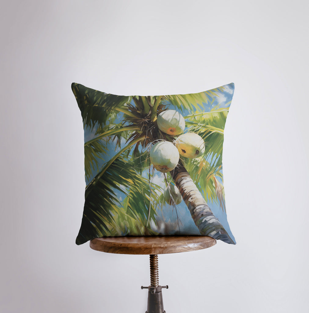 a pillow that has a picture of a coconut tree on it