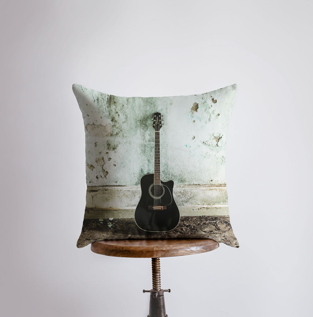 a guitar pillow sitting on top of a table