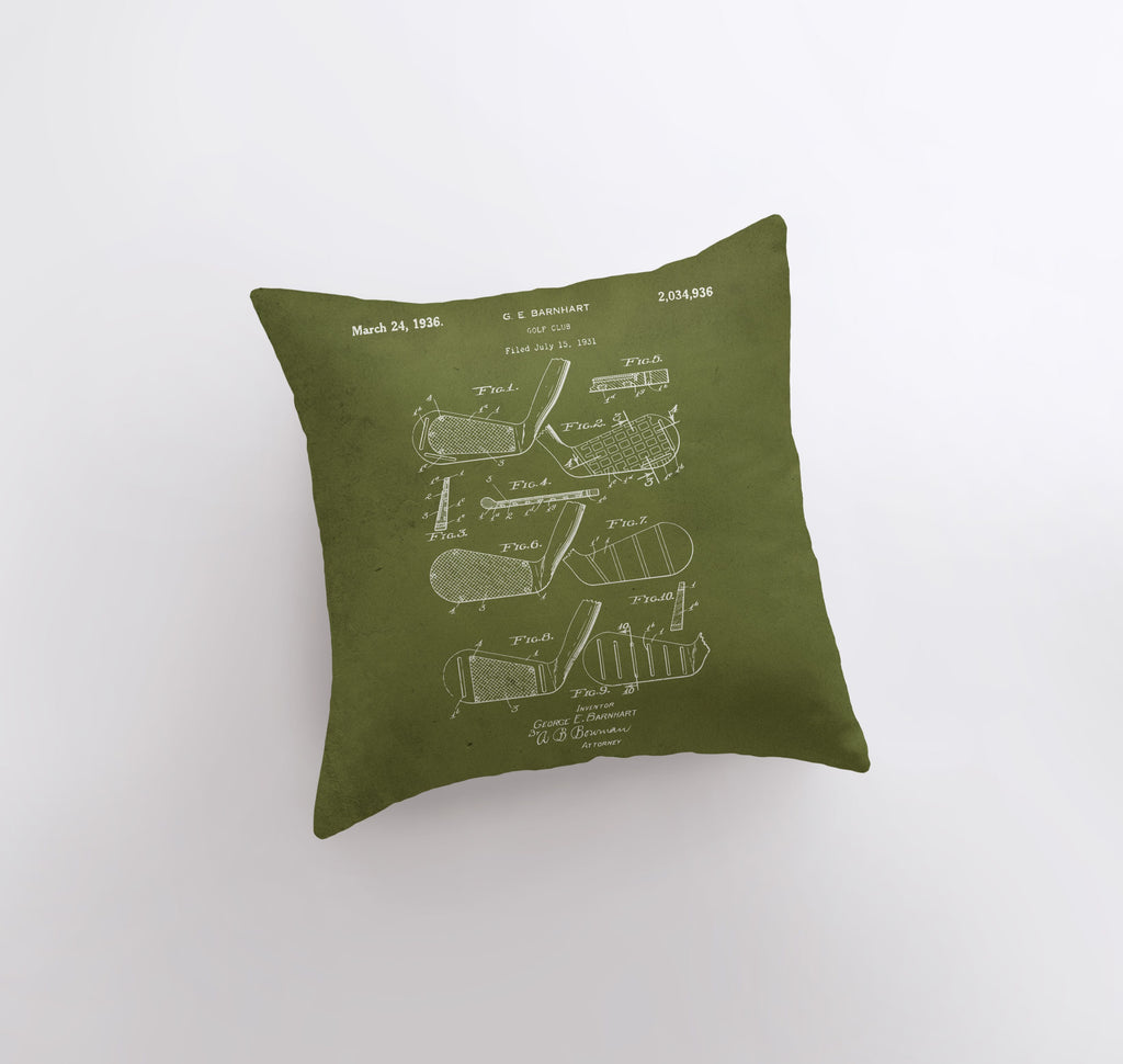 a green pillow with a drawing of a machine